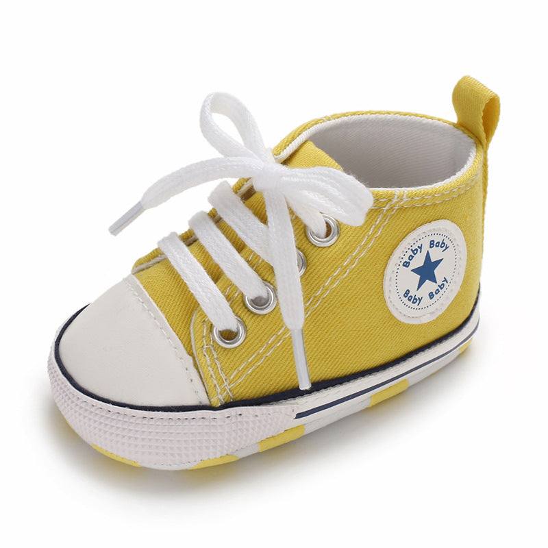 Baby yellow converse sales shoes